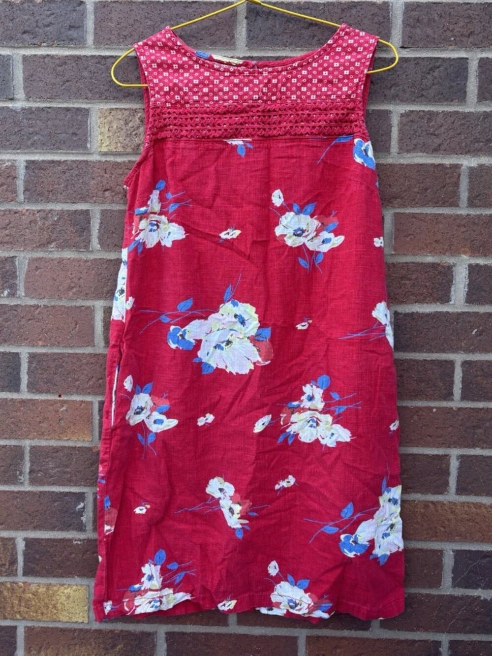 A cotton and linen blend dress with a red floral pattern